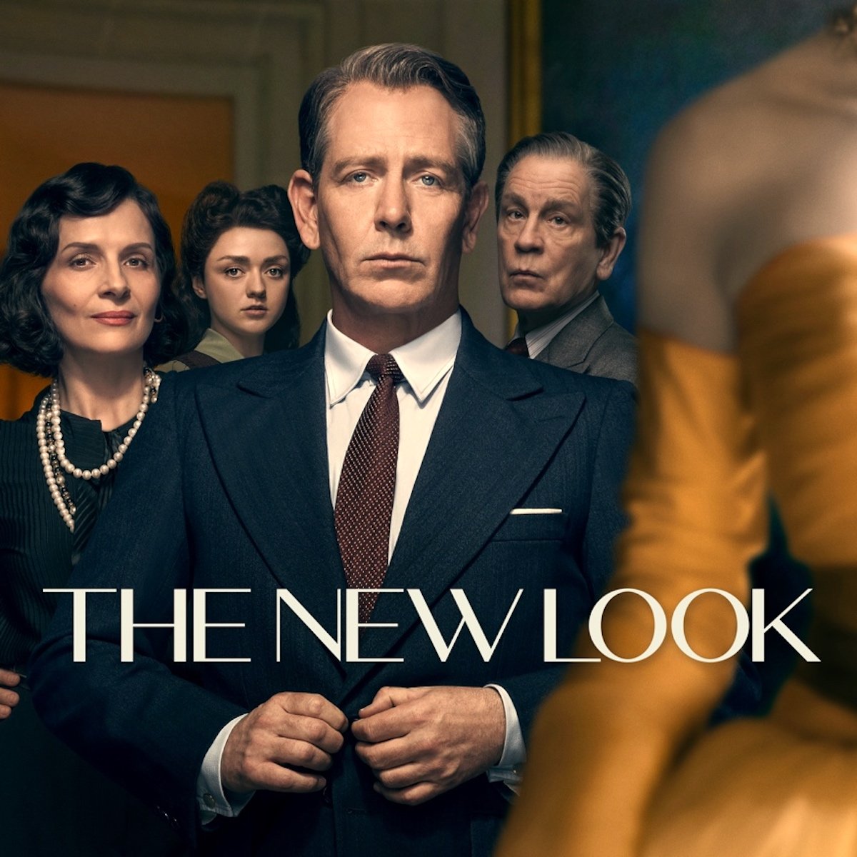 Ben Mendelsohn is front and center with Juliette Binoche, Maisie Williams, and John Malkocich behind them, with everyone dressed well in a poster for Apple TV+'s The New Look
