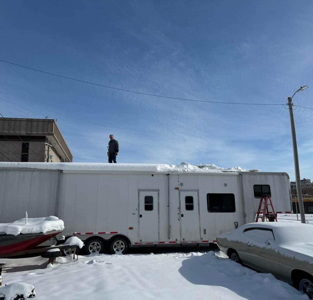 Robbie had to shovel more than a foot of snow off the roof of his trailer
