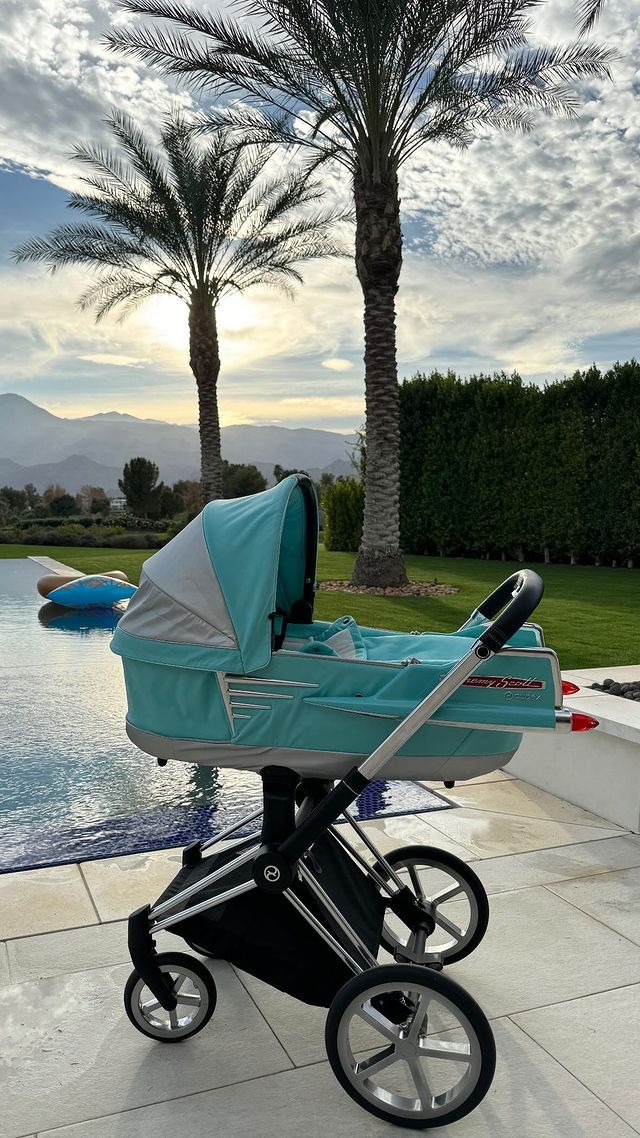 Kourtney posted a photo of the turquoise stroller by designer Jeremy Scott/Cybex parked in her backyard