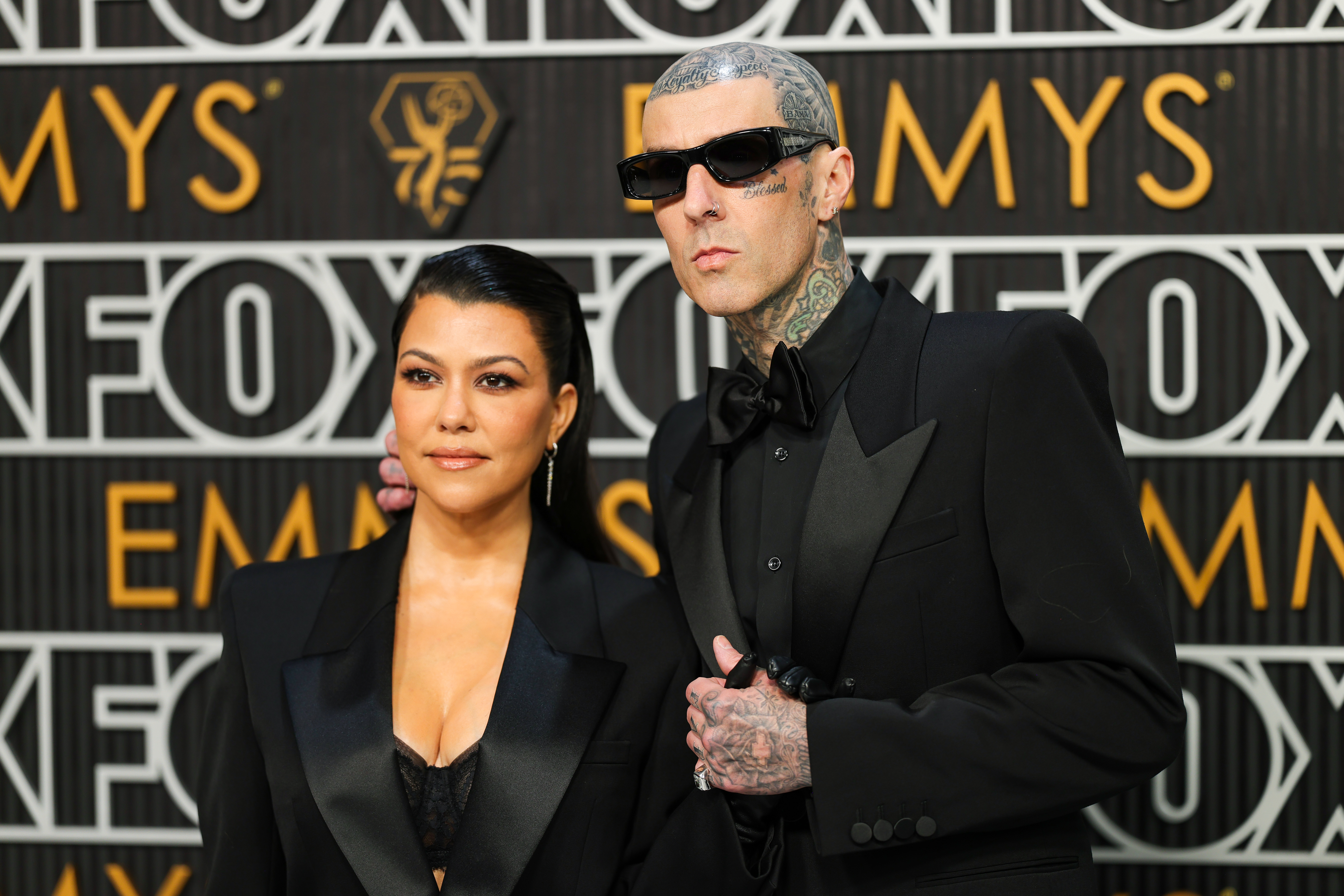 Kourtney Kardashian and Travis Barker pictured at the Emmy Awards in January 2024