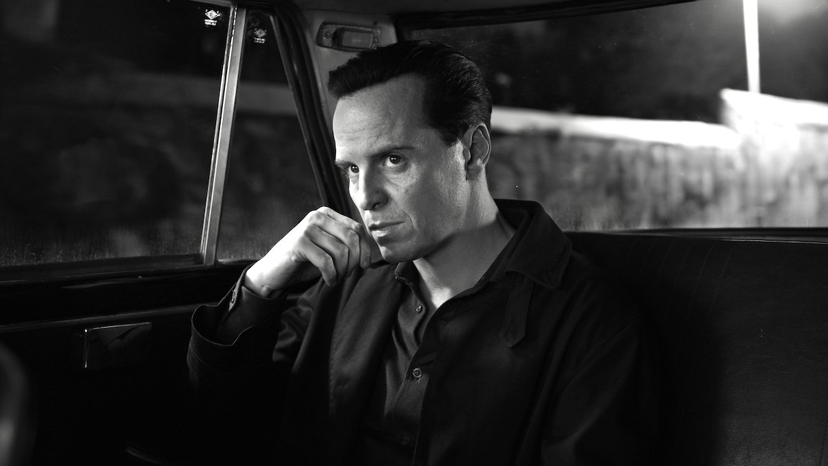 Andrew Scott with his hand on his chin in a car in the black-and-white Ripley series from Netflix