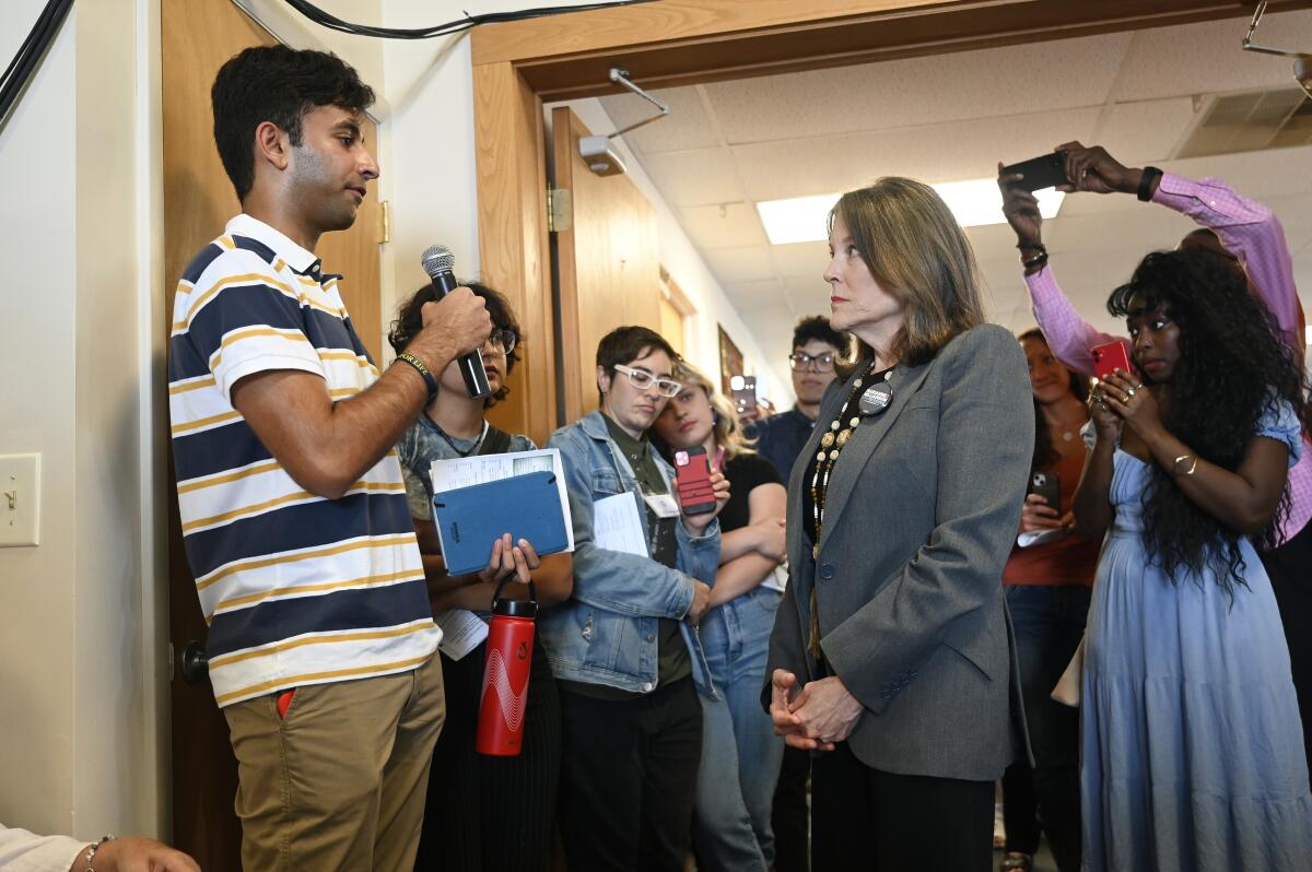 Democratic presidential candidate Marianne Williamson  answers a question from University of Michigan senior Mahi Vyas.