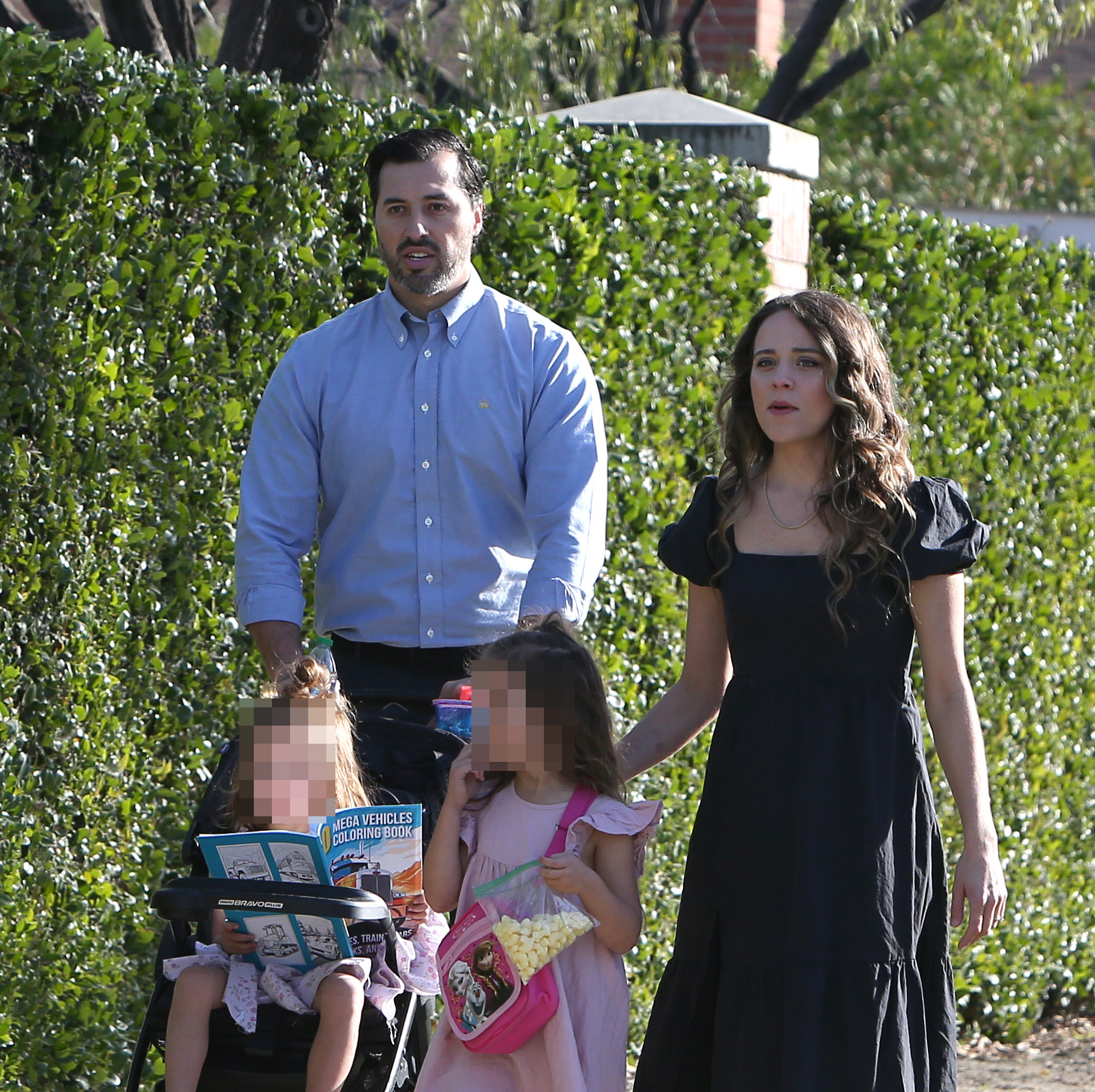 Jeremy pushed the couple's youngest daughter Evangeline in a stroller as their oldest, Felicity, walked beside them