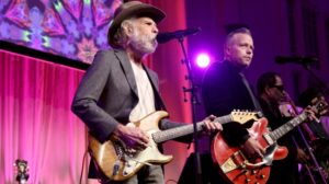 Bob Weir performs on stage with Jason Isbell.