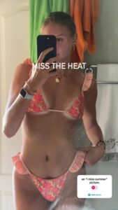 Cate Reese taking a selfie in her bikini.