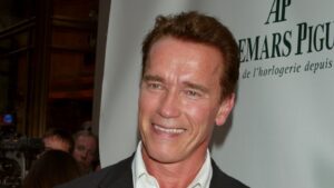 Arnold Schwarzenegger posing with Audemars Piguet watch
