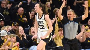 Iowa guard Caitlin Clark reacts after hitting a three-point shot