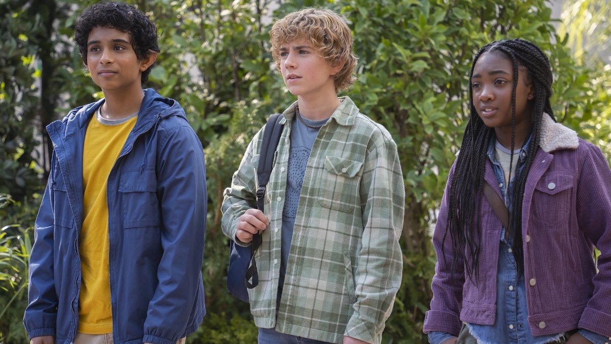 Grover, Percy, and Annabeth standing in the forest in Percy Jackson and the Olympians