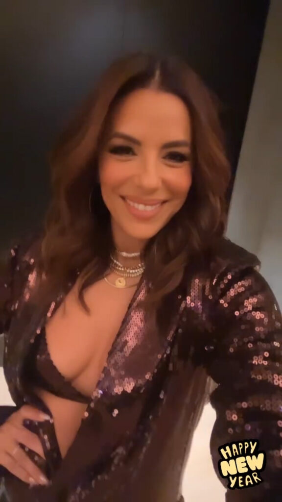 Eva Longoria flashed her bra and stunned in a plunging pantsuit as she celebrated at a lavish party with friends in Miami