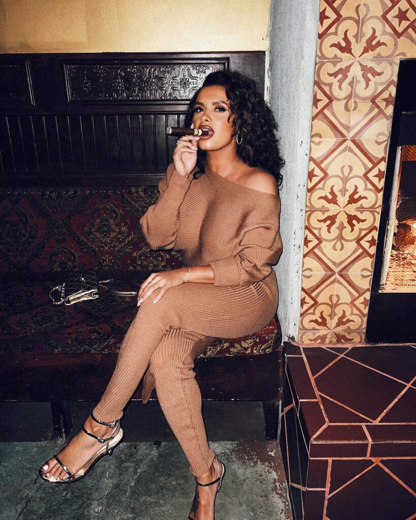 Joy Taylor enjoyed a cigar during a recent night out in Hollywood