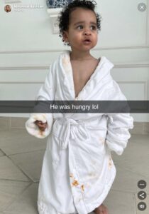 Khloe Kardashian has revealed her son Tatum's mess as the one-year-old wore a robe covered in food stains for a new photo
