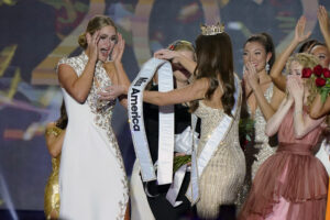 Miss Wisconsin Grace Stanke is presented with the Miss America 2023 sash by Miss America 2022 Emma Broyles in Uncasville, Connecticut on Thursday, December 15, 2022