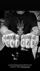 Travis Barker shared a photo of his knuckle tattoo reading 'Dues paid self made'
