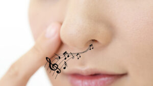 musical notes coming out of a woman's nose