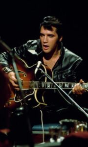 Rock and roll musician Elvis Presley performs