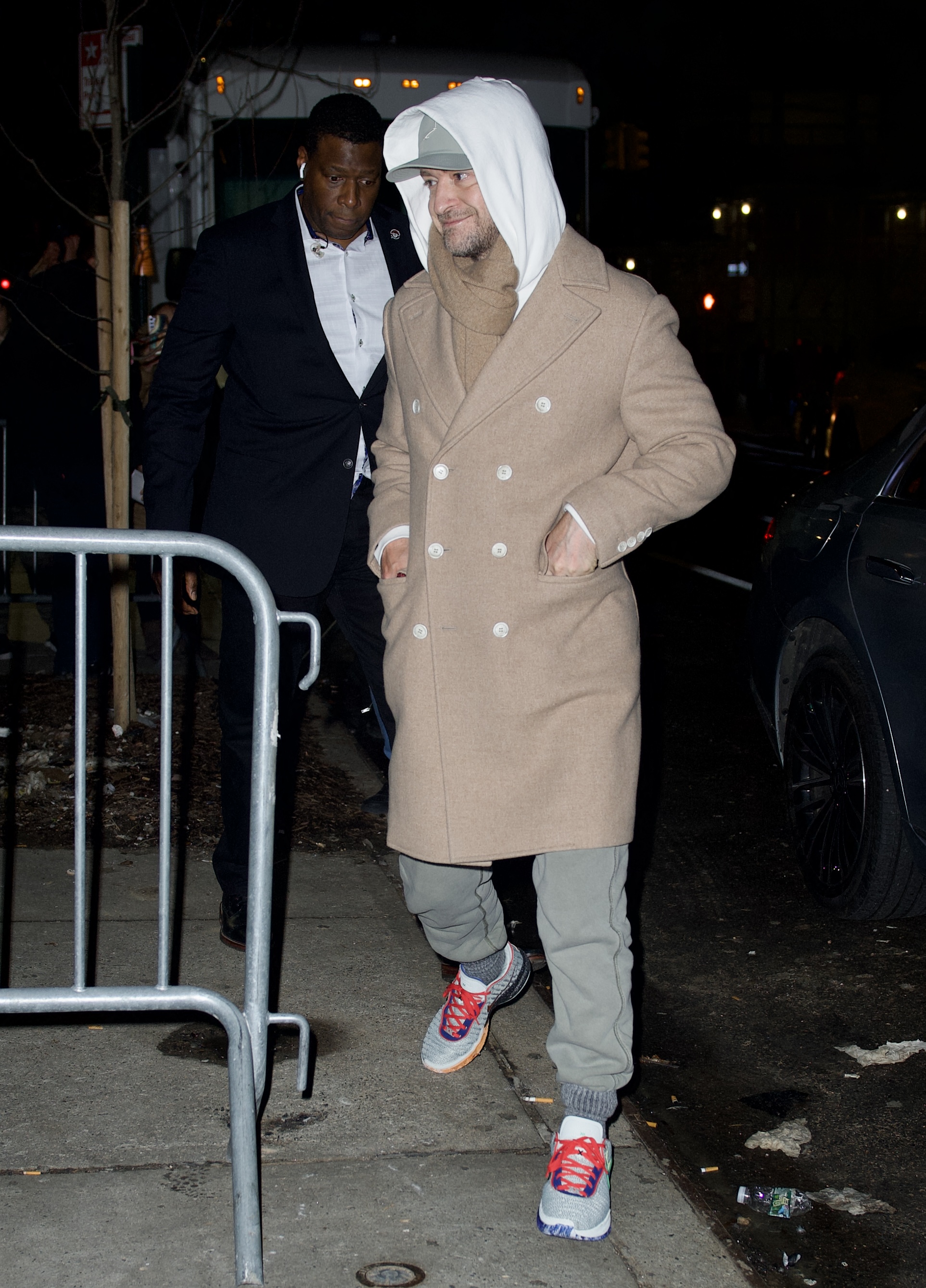 Justin wore a beige coat with a hoodie while out in public in 2024