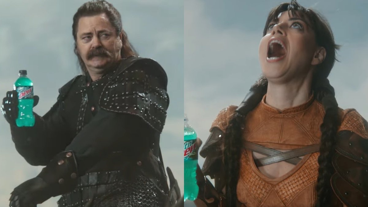 Nick Offerman with a mustache atop a dragon holding a Baja Blast next to Aubrey Plaza atop a dragon holding one too in a MTN DEW Baja Blast commercial