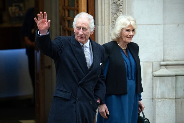 King Charles III waves as he departs with Queen Camilla after receiving treatment for an enlarged prostate at The London Clinic on Jan. 29.