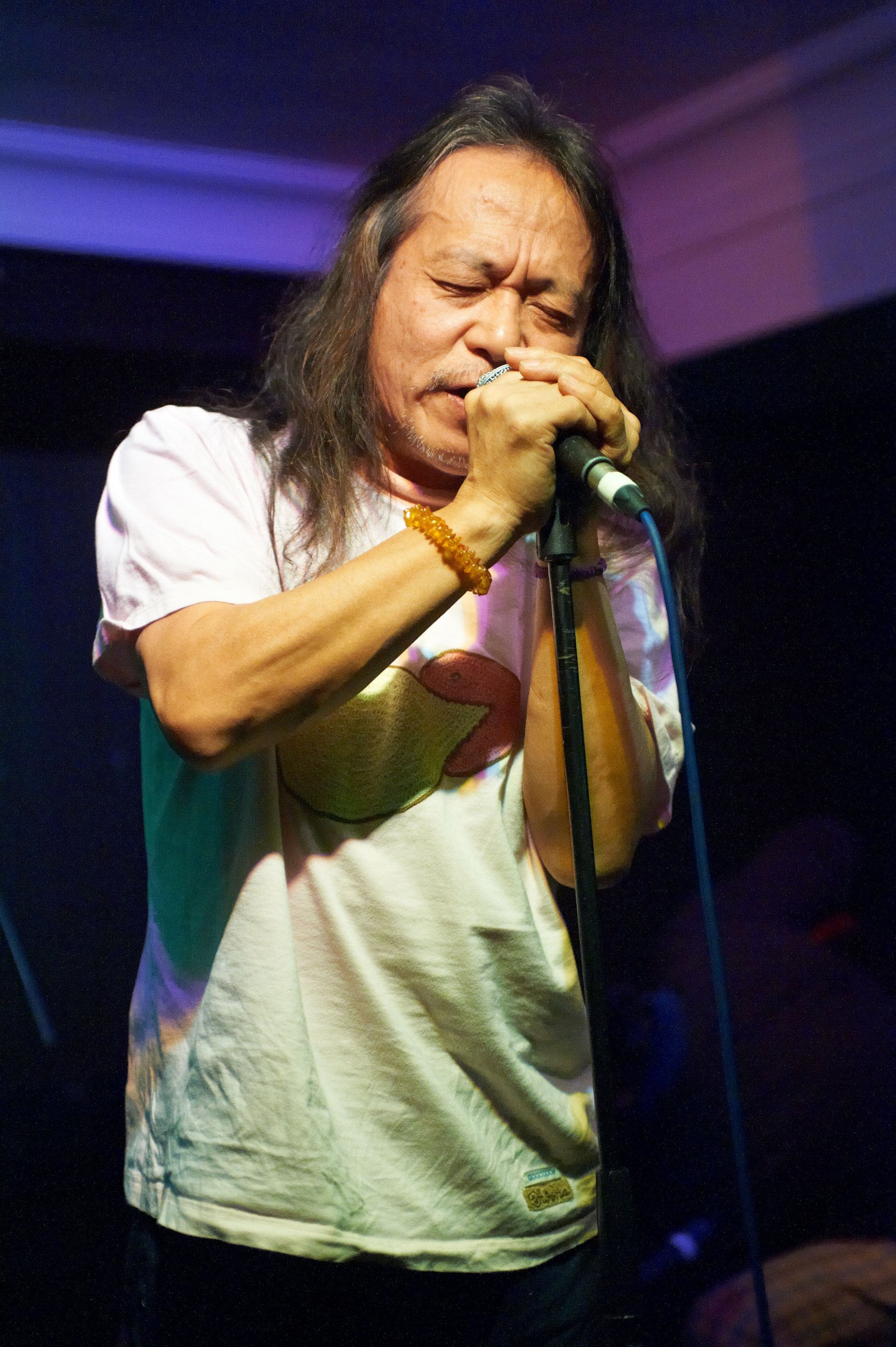 Damo Suzuki performs on stage at The Harley on December 9, 2010, in Sheffield, England