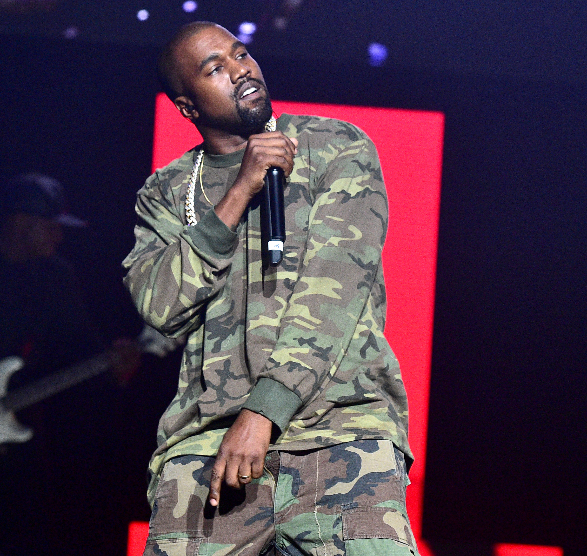 Kanye pictured performing onstage back in July 2015