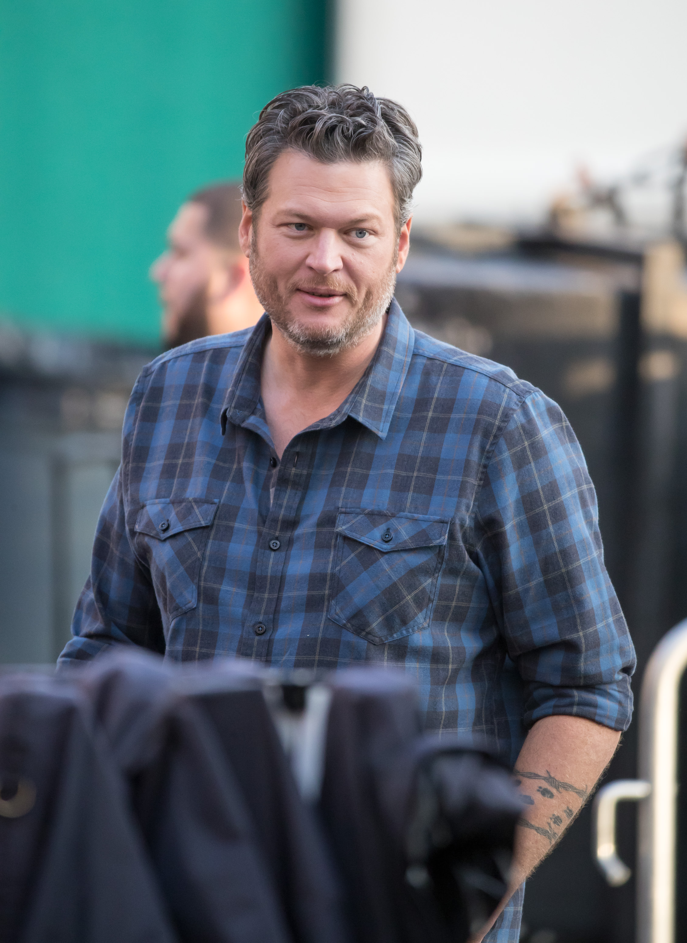 Blake seemed somber as he answered back to Gwen's 'Hello?' amid rumors the two may be having issues in their marriage