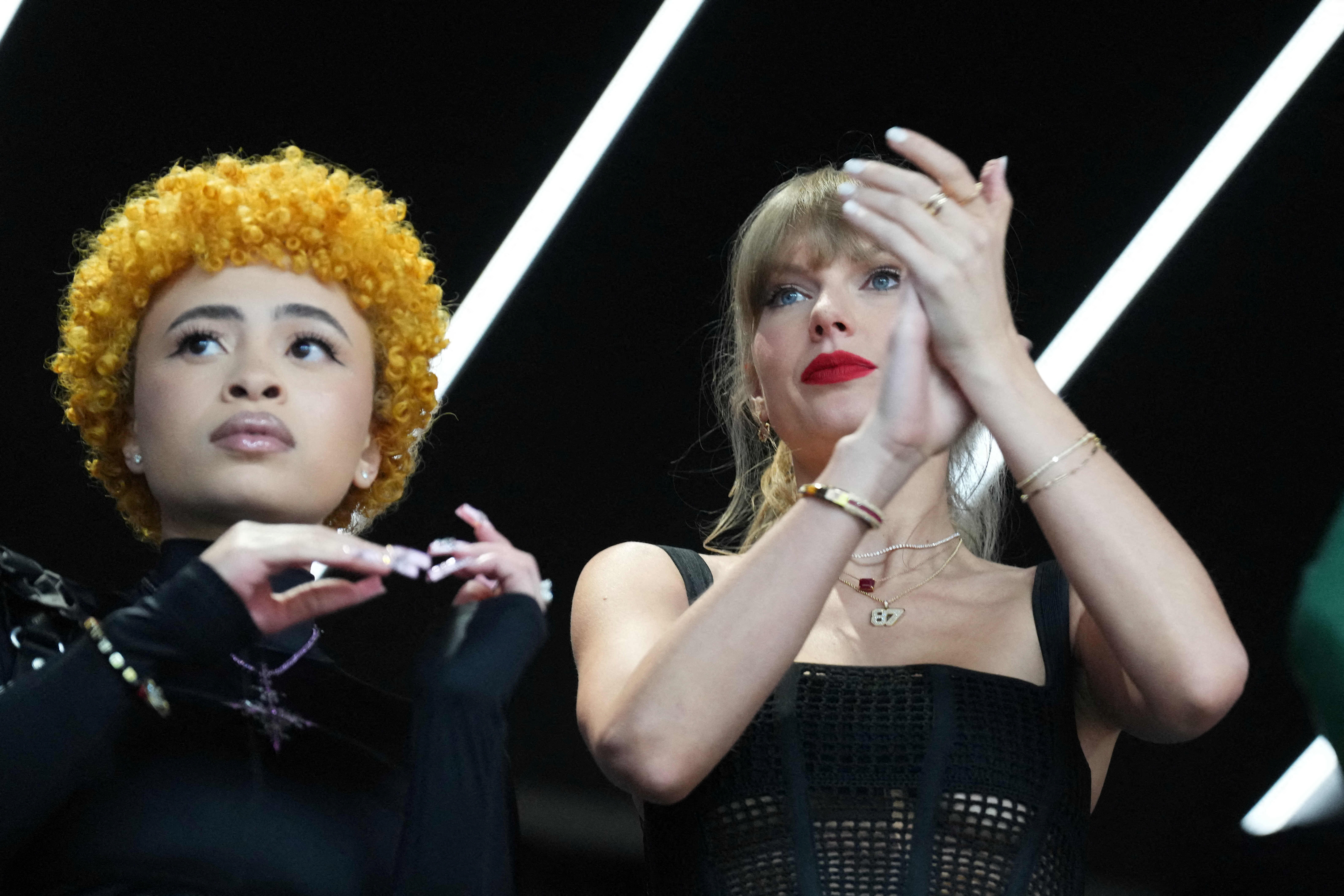 Taylor Swift's fans noted that Ice Spice accessorized with an upside-down cross necklace