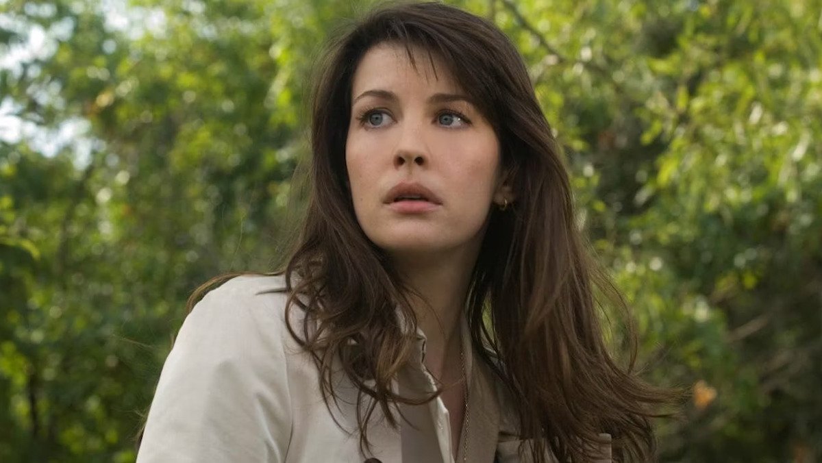 Liv Tyler as Betty Ross in The Incredible Hulk stands in front of trees, looking worried