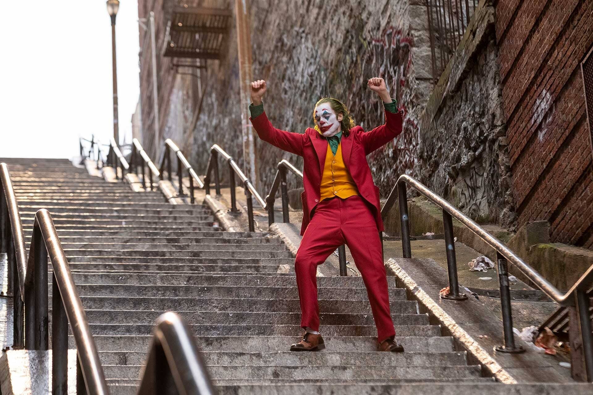 Arthur Fleck dances down the stairs in the first Joker film.