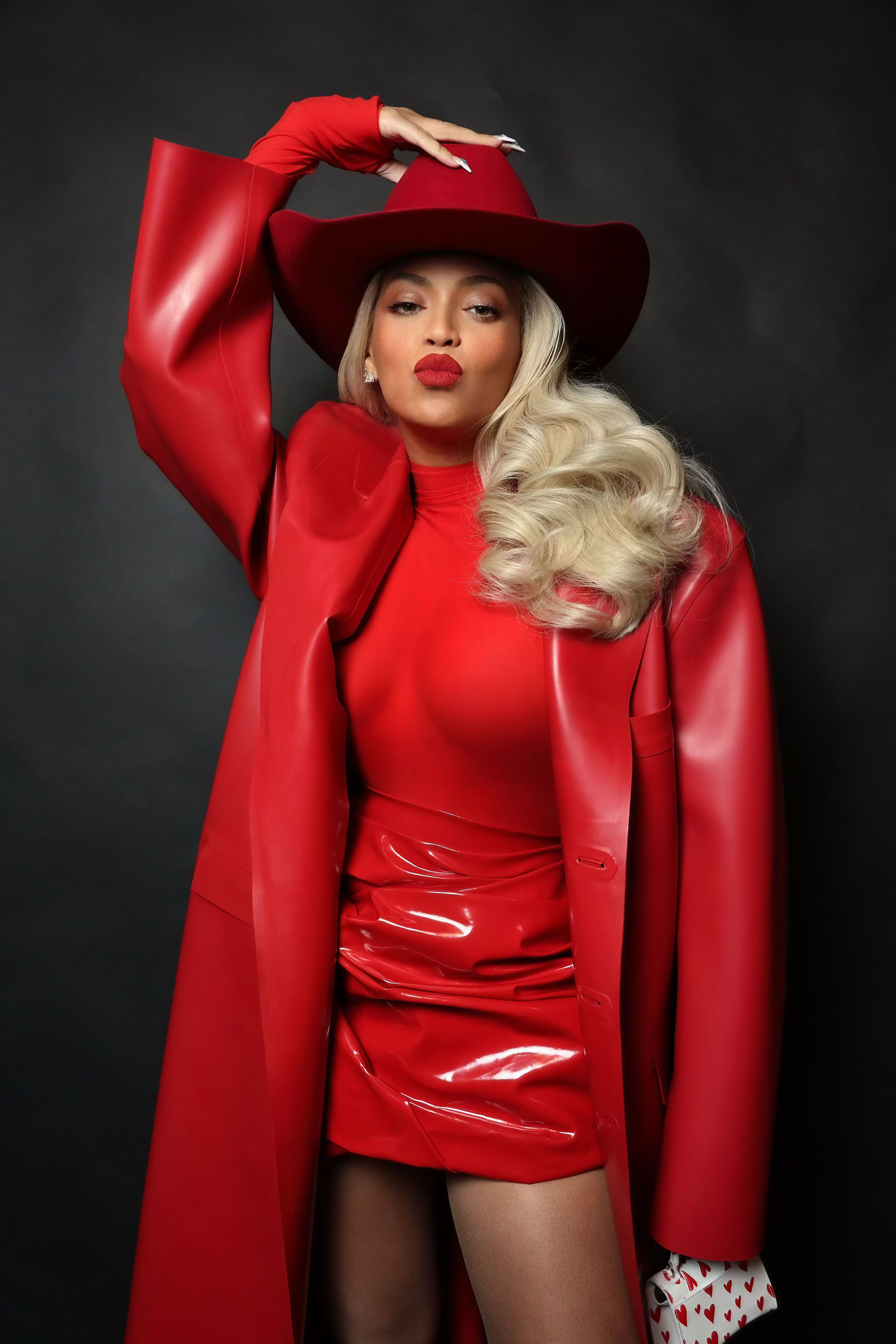 Bey topped off her look with a red velvet cowgirl hat