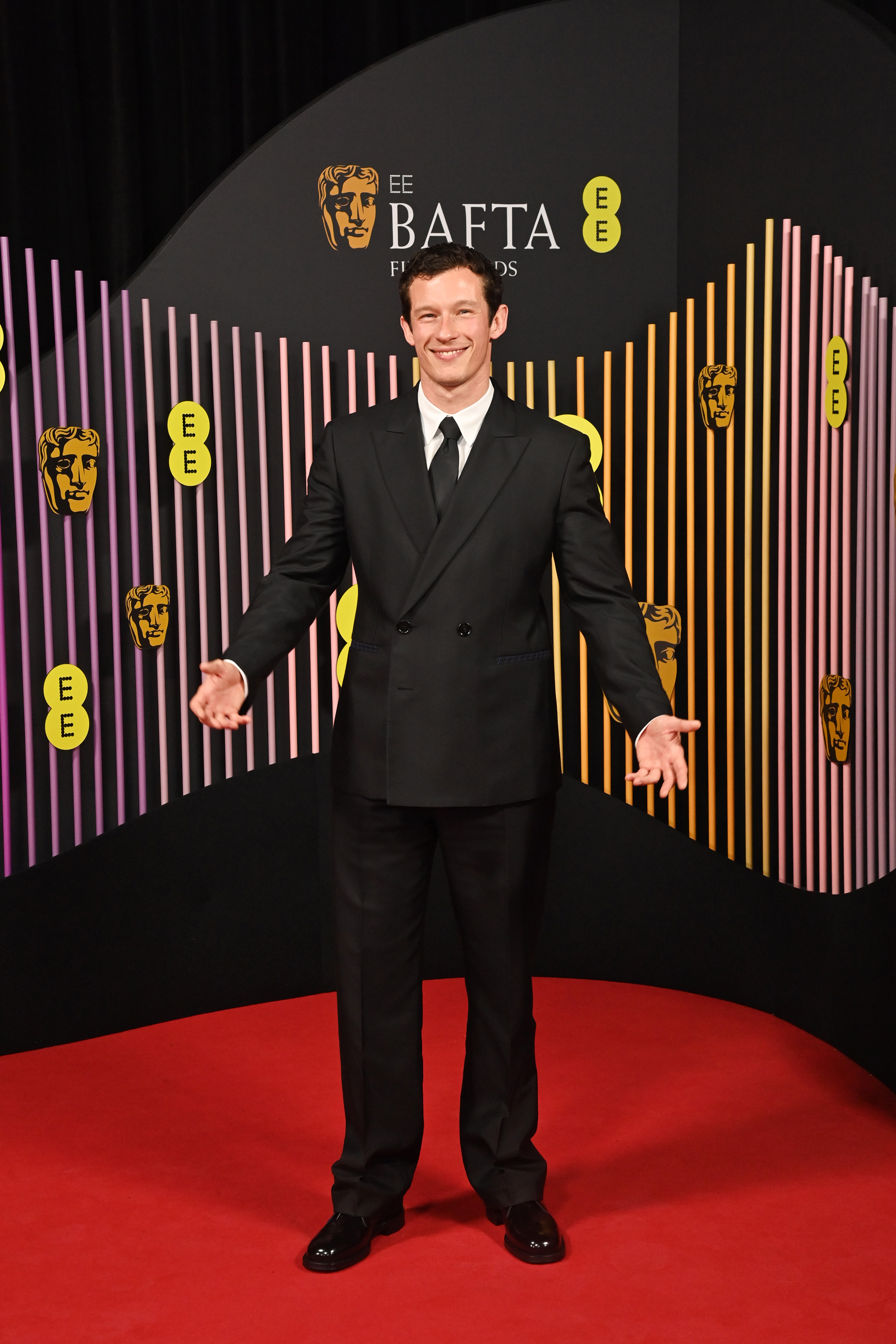 Callum Turner looked relaxed as he posed for photographers