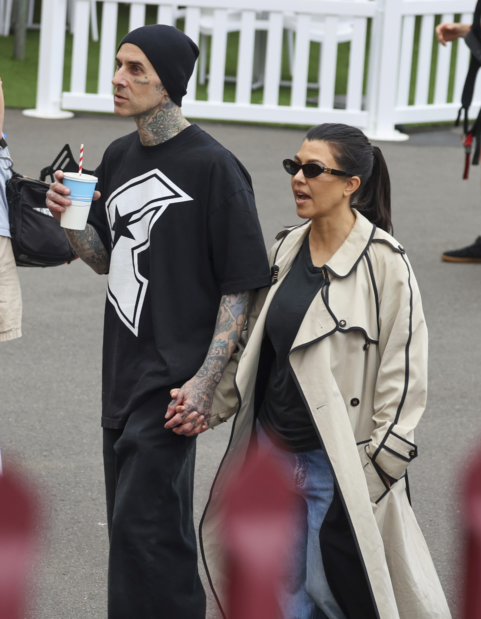 Kourtney Kardashian (right) and Travis Barker (left) held hands during their romantic stroll