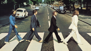 The Beatles crossing Abbey Road in their iconic album cover