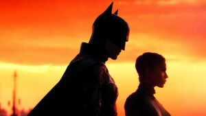 Batman and Catwoman against a sunset in a still from The Batman