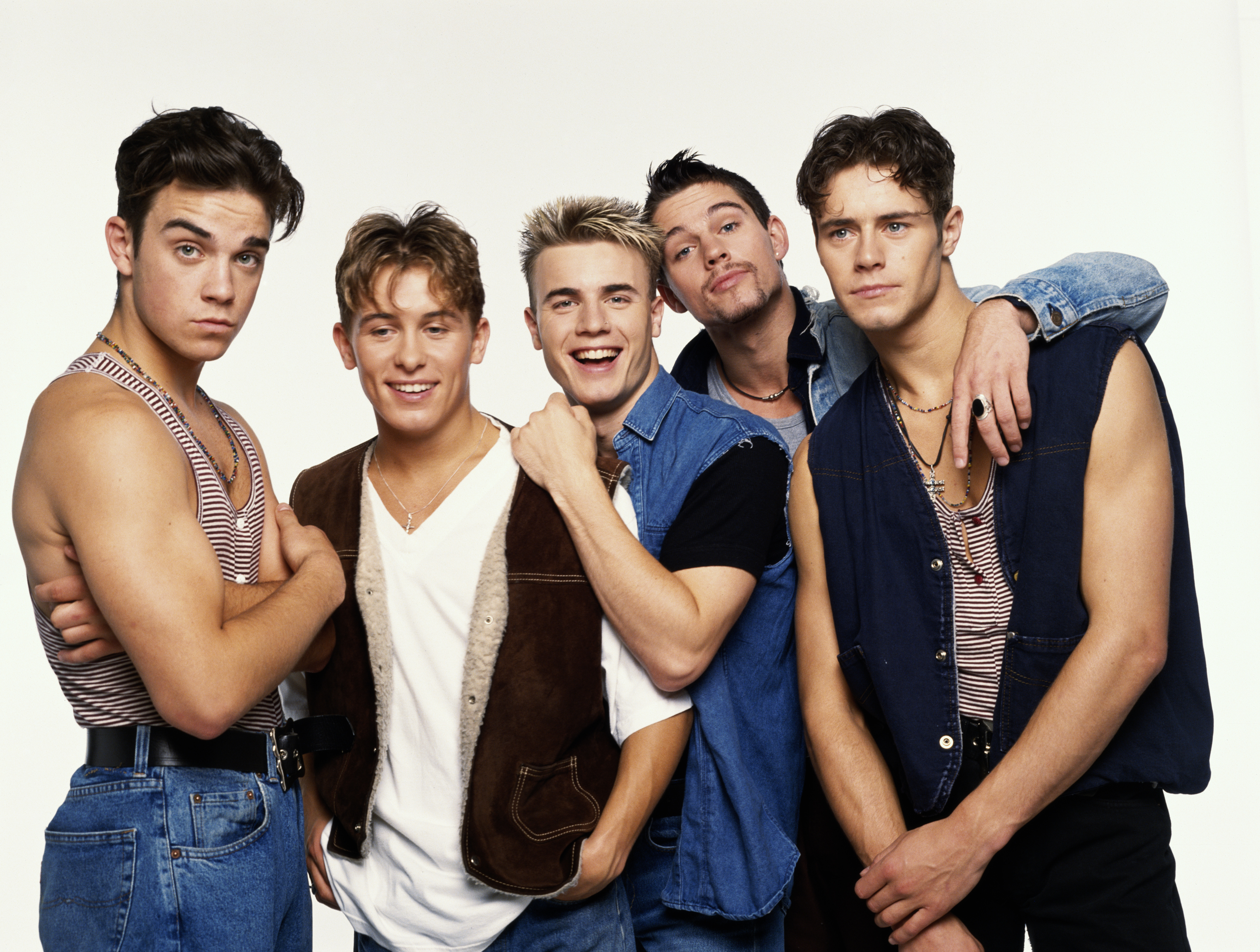 Robbie (left) found fame in Take That 30 years ago