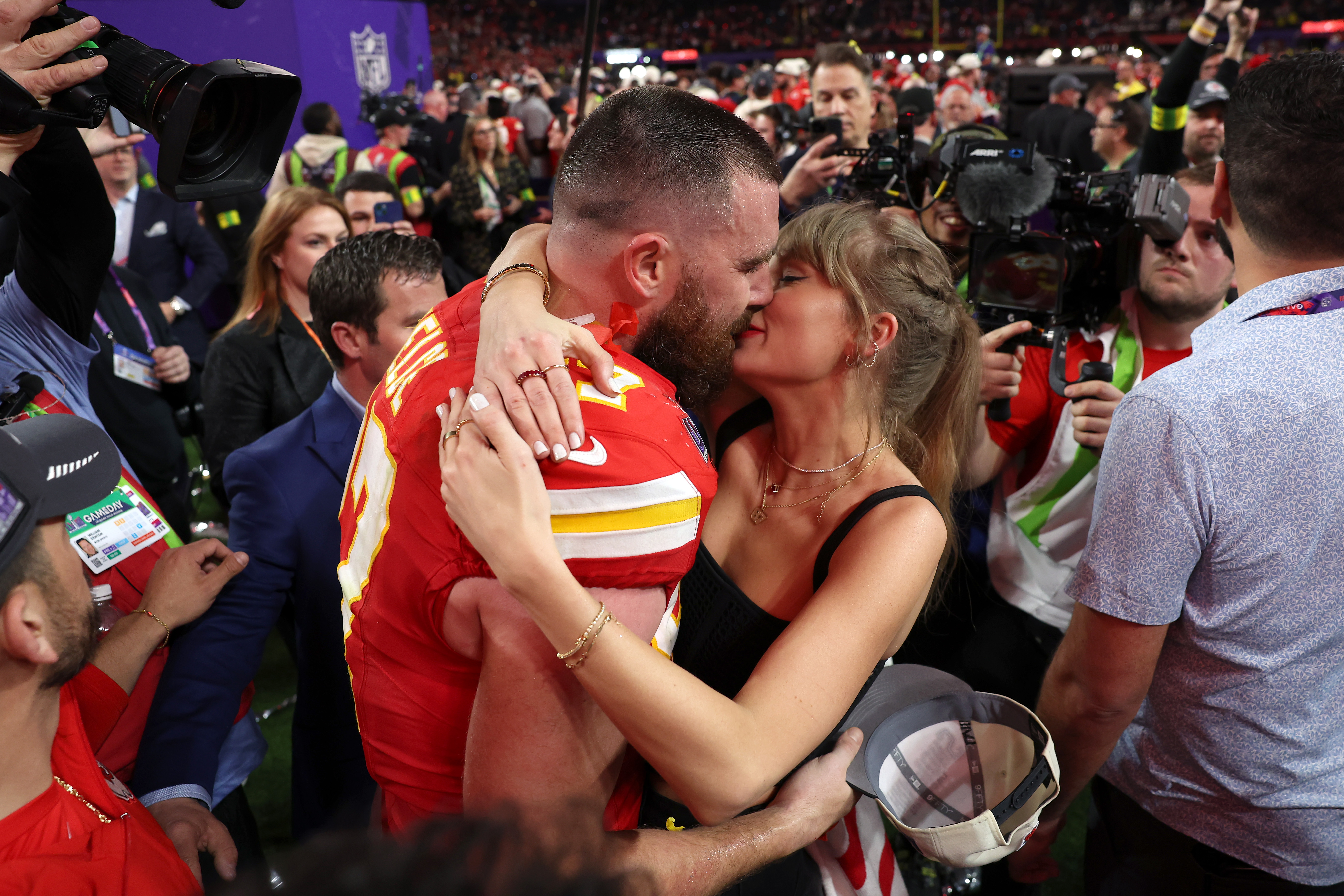Swift and boyfriend Kelce kiss after the Chiefs defeated the San Francisco 49ers at the Super Bowl