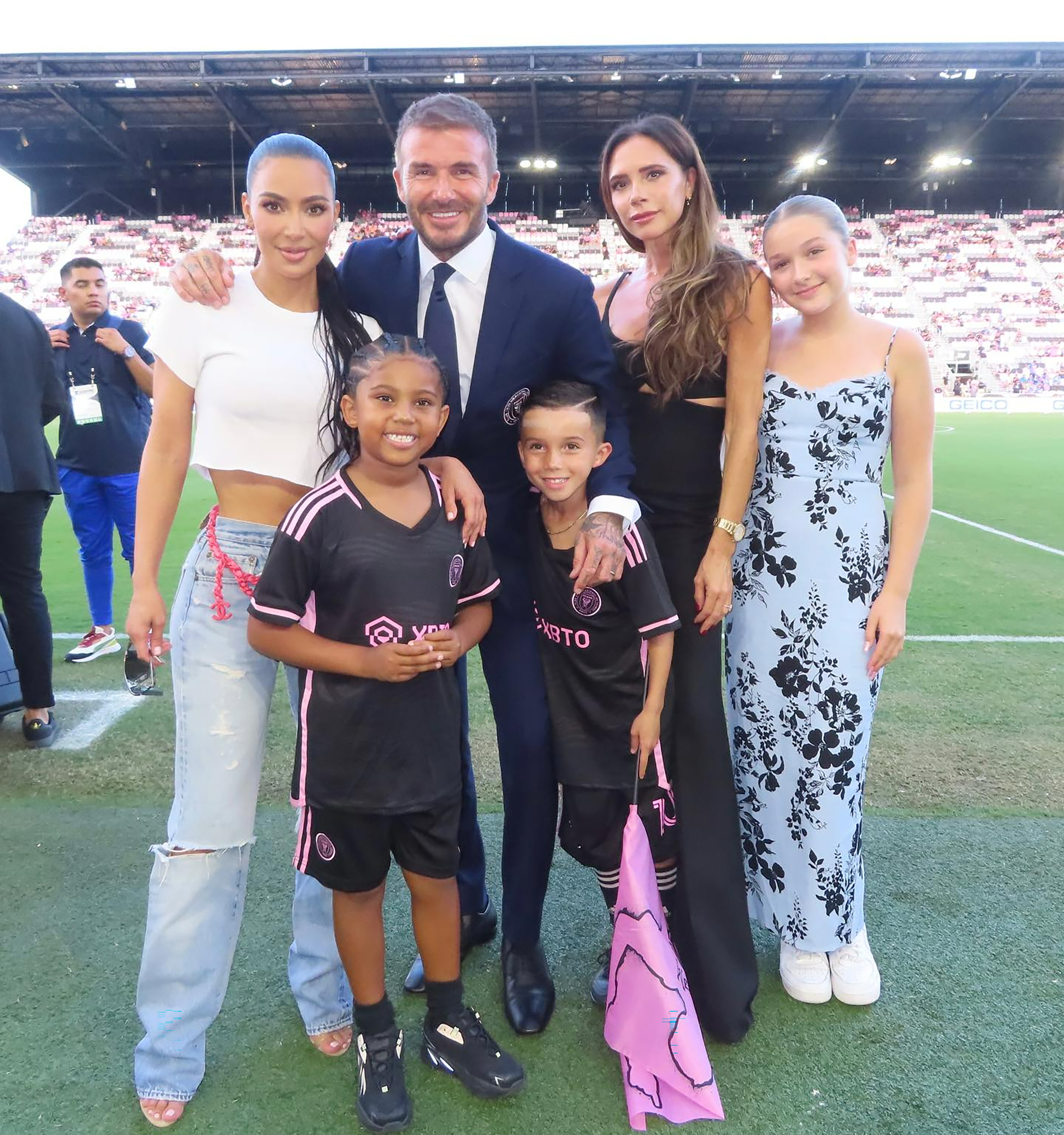 Kim and Saint pictured with David and Victoria Beckham