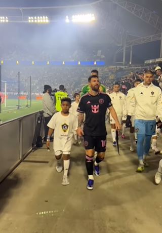 Saint participated as a player escort during Lionel's Inter Miami CF game