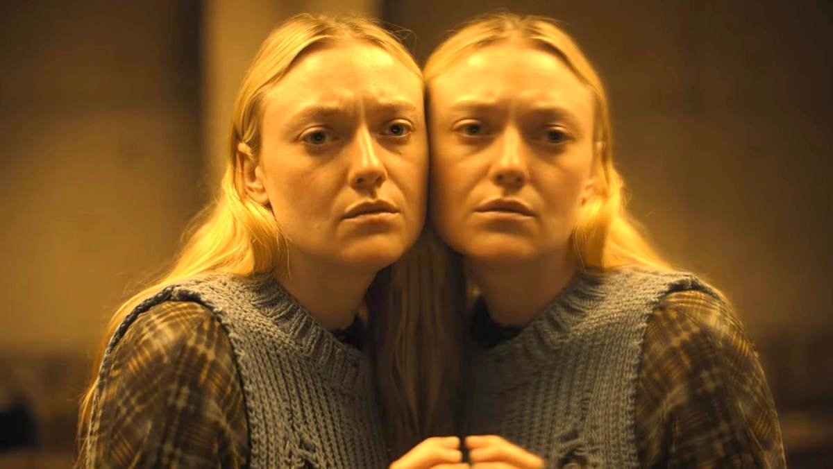 dakota fanning stands in a mirror with her face against in it the watchers horror movie trailer