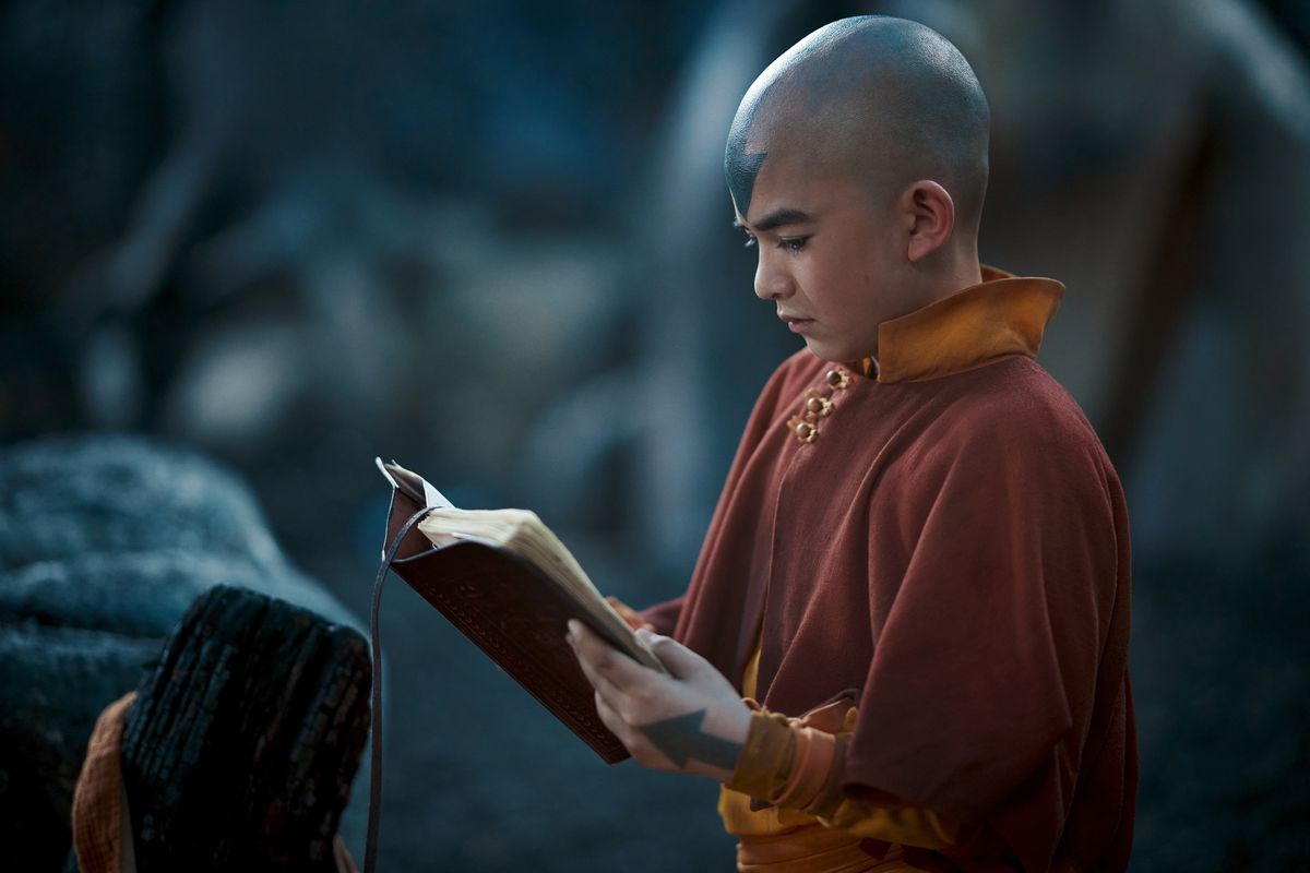 Aang (Gordon Cormier) reading a book