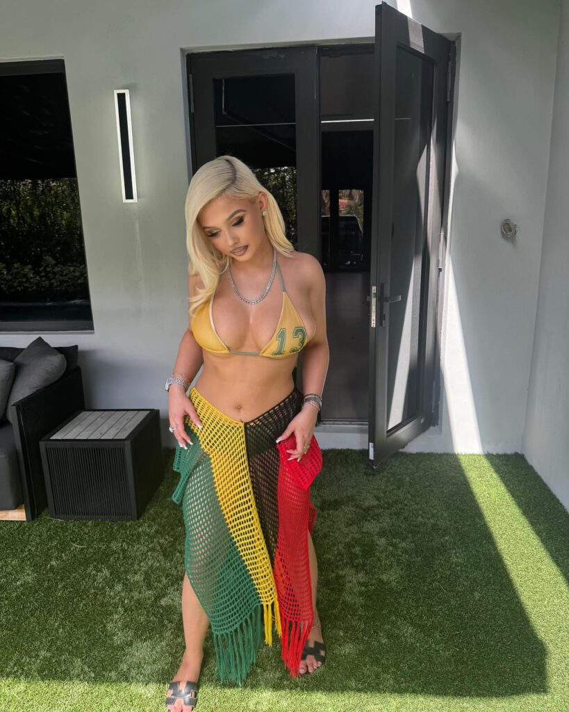 Alabama Barker has shown off her curves in a green and yellow bikini in new pics