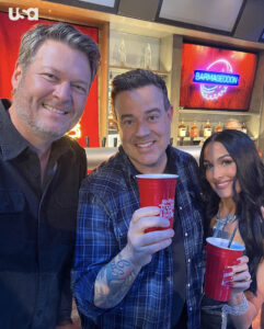 Blake Shelton (left) was seen partying in a new photo with Carson Daly (center) and Nikki Garcia (right) as the trio celebrated wrapping up Season 2 of Barmageddon
