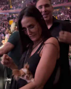 Demi Moore is being bashed for bringing her tiny dog Pilaf to a Madonna concert this week