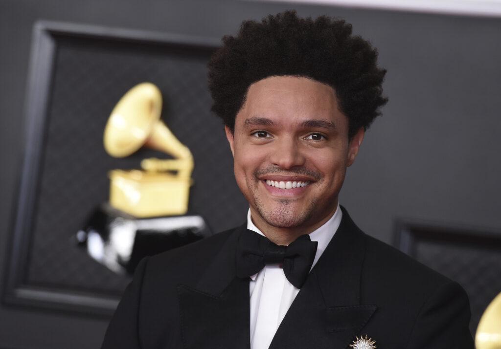 Trevor Noah smiles at the 63rd Grammy Awards on March 14, 2021, and is set to host for the fourth time at the 66th annual Grammy Awards on Sunday, February 4, 2024