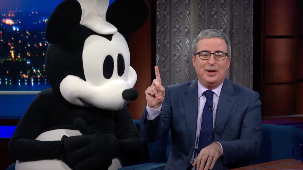 John Oliver Dares Disney to Sue Him During Colbert Appearance