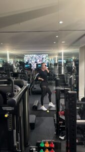 Khloe Kardashian shared a new gym selfie while showing off her slimmer figure in mesh leggings and a skintight top
