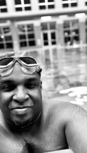 Damon Thomas shared a black and white photo of himself in a swimming pool
