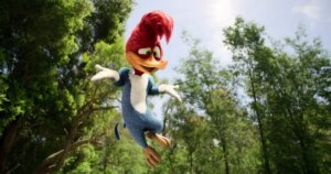 Woody Woodpecker jumping. This image is part of an article about how Netflix's Woody Woodpecker first look will give you live-action Sonic vibes.