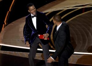 Chris Rock and Will Smith on stage at the 2022 Oscars