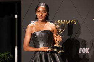 Ayo Edebiri poses with her Emmy, moments after winning the award for Outstanding Supporting Actress in a Comedy Series for The Bear at the 75th Primetime Emmy Awards in Los Angeles on Monday, January 15, 2024