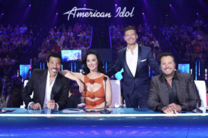 American Idol is hosted by Ryan Seacrest with Lionel Richie, Katy Perry, and Luke Bryan as judges